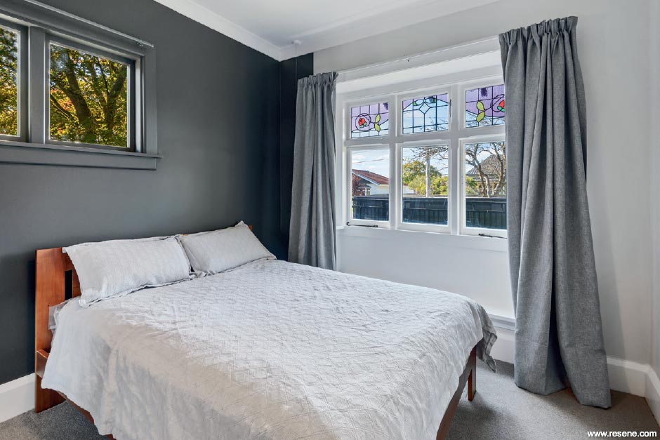 A dark grey and white bedroom