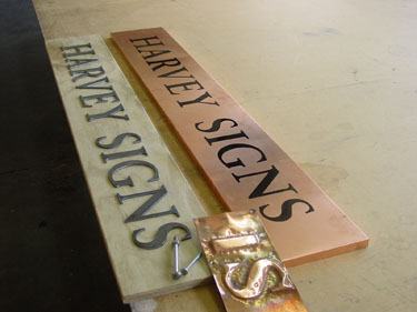 Embossed copper sign
