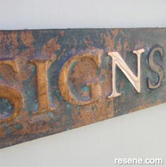Embossed copper sign