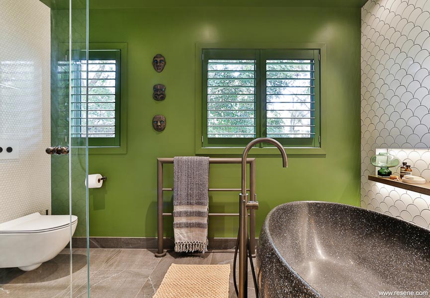 Green bathroom and tiled wall