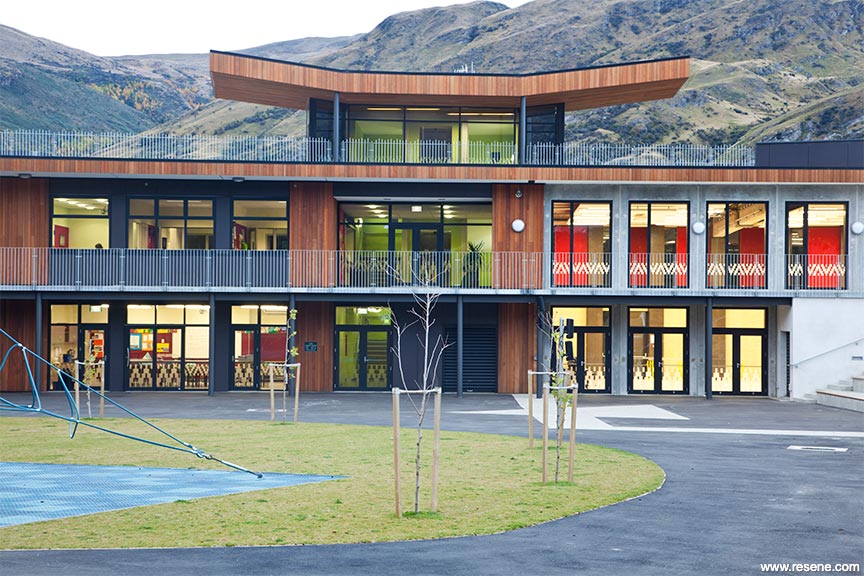 Grey and wood accents school exterior