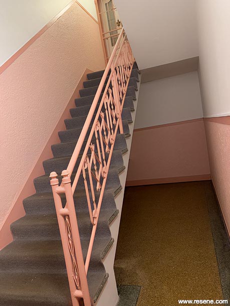 Pink and white apartment staircase
