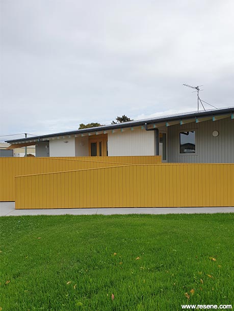 Yellow, grey, and white school exterior
