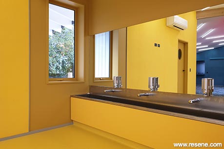 Bright yellow school bathroom