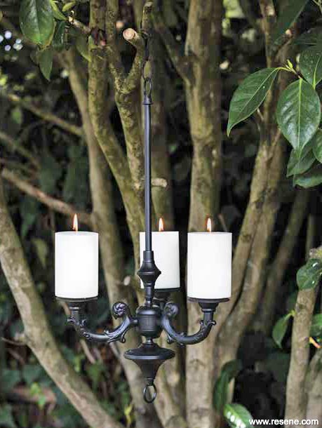 Upcycle an old chandelier into an outside candle lamp