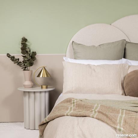 A serene sage green bedroom design
