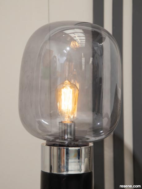 A smoke coloured glass lamp