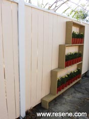 Paint a wooden fence