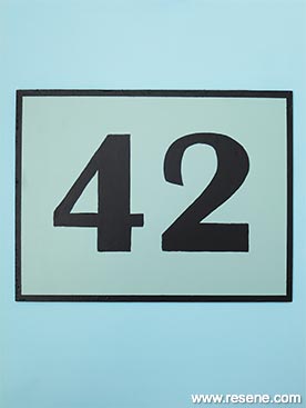 Wooden painted house number